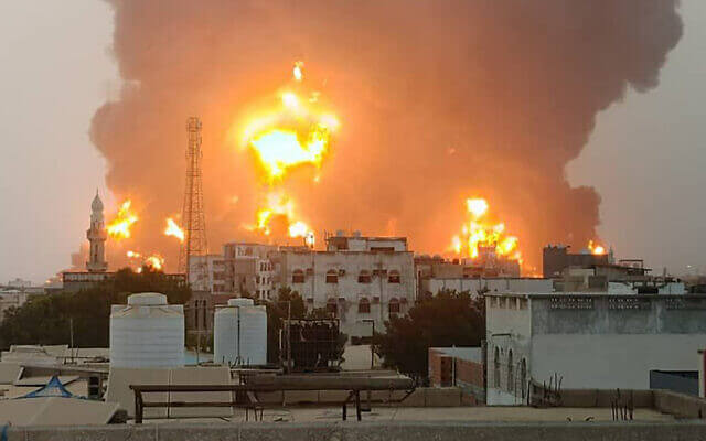 A handout picture obtained from Yemen’s Houthi Ansarullah Media Center show a huge column of fire erupting following Israeli strikes in the Yemeni rebel-held port city of Hodeida on July 20, 2024. AFP