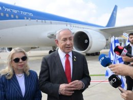 Benjamin Netanyahu speaks to the press before departing to Washington, DC. GPO