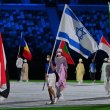 Israeli gold medalist Linoy Ashram (C) carries the national flag during the closing ceremony of the Tokyo 2020 Olympic Games, at the Olympic Stadium, in Tokyo, on August 8, 2021. AFP