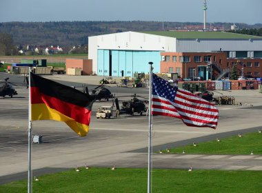 U.S. and German flags fly outside 12th Combat Aviation Brigade Headquarters in Ansbach, Germany. U.S. Army