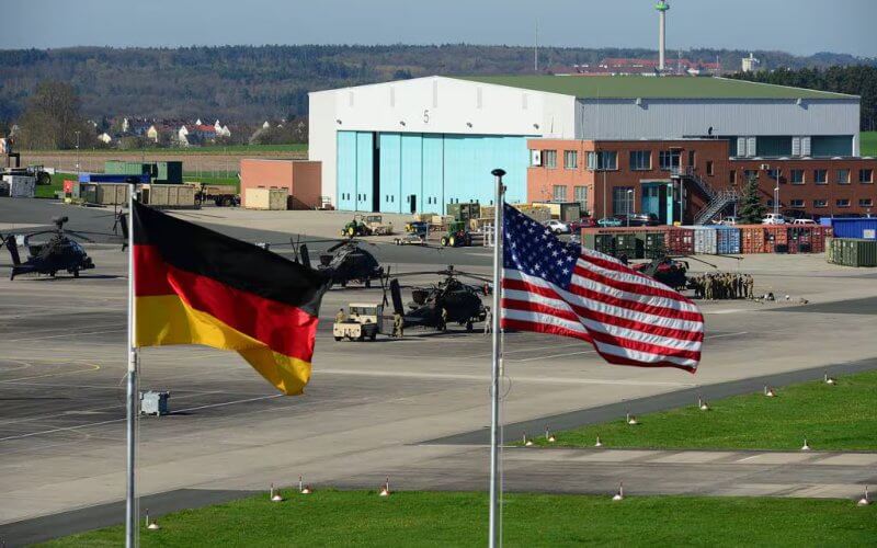 U.S. and German flags fly outside 12th Combat Aviation Brigade Headquarters in Ansbach, Germany. U.S. Army