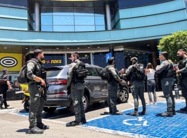 Israeli security personnel stand at the entrance to a shopping mall following a stabbing attack in Karmiel, northern Israel July 3 2024. Reuters