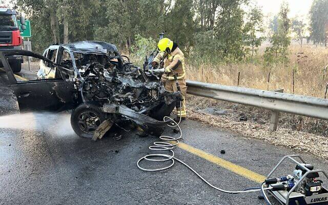 Firefighters are seen at the scene of a rocket impact near the Nafah Junction in the Golan Heights, July 9, 2024. Israel Fire and Rescue Services