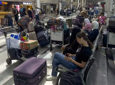 Passengers wait after their flights were delayed or canceled at Rafik Hariri International Airport, in Beirut. AAP / WAEL HAMZEH/EPA