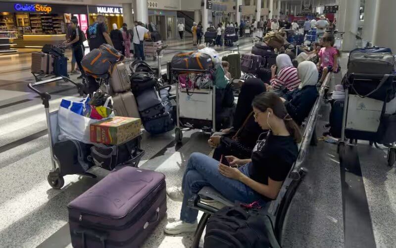 Passengers wait after their flights were delayed or canceled at Rafik Hariri International Airport, in Beirut. AAP / WAEL HAMZEH/EPA