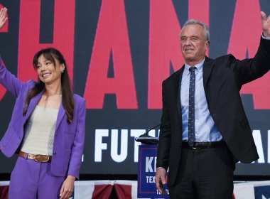 Presidential candidate Robert F. Kennedy Jr. right, waves on stage with Nicole Shanahan, after announcing her as his running mate on Tuesday, March 26, 2024, in Oakland, Calif. AP