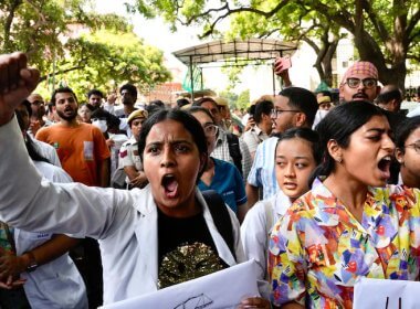 Protesters gather in front of the Indian health minister's office in New Delhi. AP