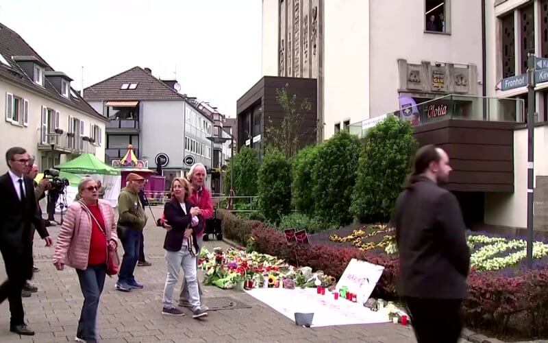 Mourners pay tribute following the knife attack. rumble.com