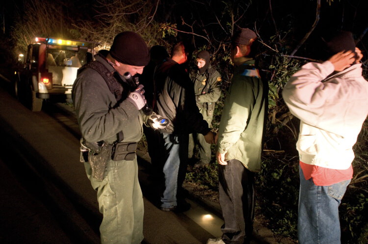 Border Patrol agents conduct pat downs of migrants who crossed the southern U.S. border illegally. U.S. Customs and Border Protection