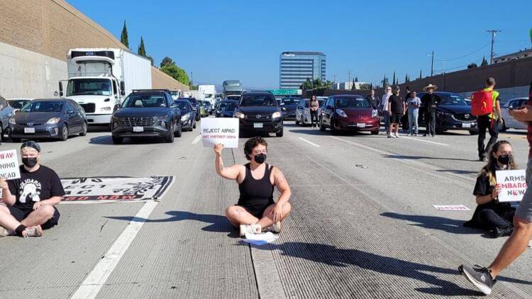 Protestors from IfNotNow Los Angeles shut down a portion of the 405 in West Los Angeles, near the Israeli consulate, during rush hour traffic. IfNotNow Los Angeles