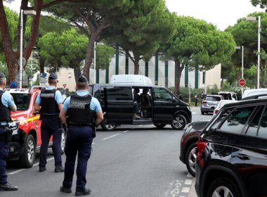 Law enforcement officers stand in front of a synagogue following a fire and explosion of cars in La Grande-Motte, south of France, on August 24, 2024. AFP