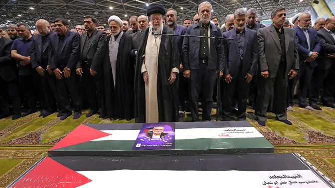 Iranian Supreme Leader Ayatollah Ali Khamenei, center, leads a prayer over the coffins of Hamas leader Ismail Haniyeh and his bodyguard who were killed in an assassination blamed on Israel on Wednesday. AP