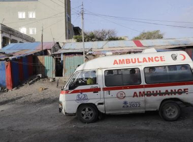 An ambulance is seen on the beach following an attack in Mogadishu, Somalia. AP