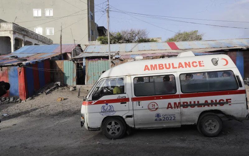 An ambulance is seen on the beach following an attack in Mogadishu, Somalia. AP