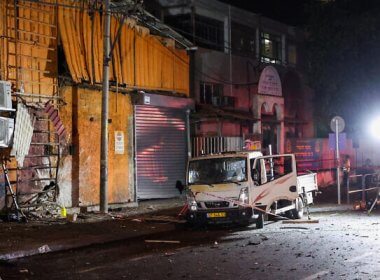 Israeli security and emergency personnel cordon off the site of an explosion in Tel Aviv on August 18, 2024. AFP