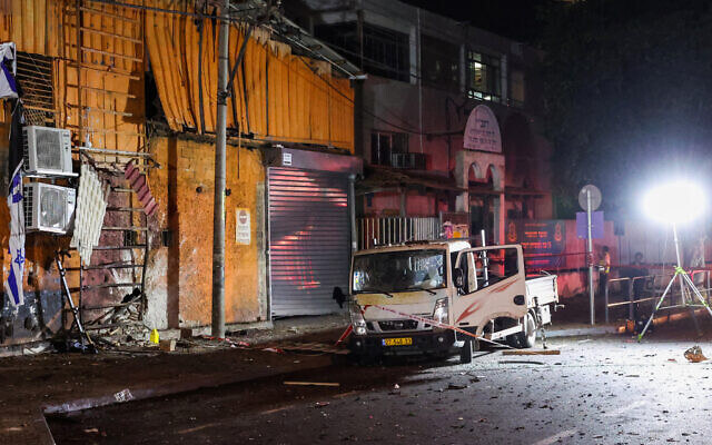 Israeli security and emergency personnel cordon off the site of an explosion in Tel Aviv on August 18, 2024. AFP