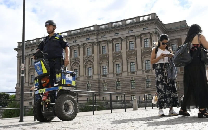 A police officer on a Segway patrols Sweden's parliament in Stockholm. TT NEWS AGENCY