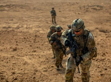 U.S. Army Staff Sgt. Kyle Grover leads a group of soldiers to the top of a hill, at Al Asad Air Base, Iraq, Nov. 18, 2022. defense.gov