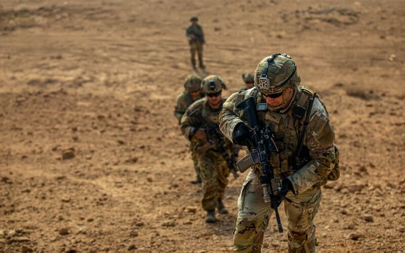 U.S. Army Staff Sgt. Kyle Grover leads a group of soldiers to the top of a hill, at Al Asad Air Base, Iraq, Nov. 18, 2022. defense.gov