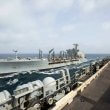 The USNS Big Horn sails alongside the USS Abraham Lincoln during a replenishment-at-sea on Sept. 11, 2024. US Navy