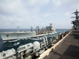 The USNS Big Horn sails alongside the USS Abraham Lincoln during a replenishment-at-sea on Sept. 11, 2024. US Navy