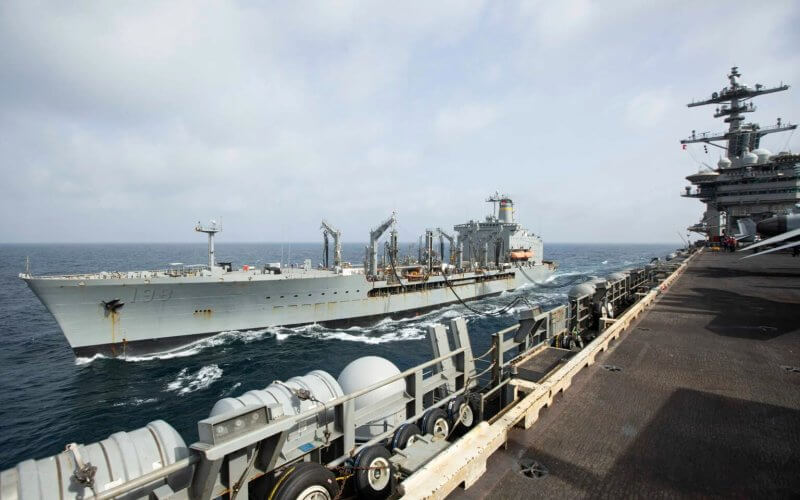 The USNS Big Horn sails alongside the USS Abraham Lincoln during a replenishment-at-sea on Sept. 11, 2024. US Navy