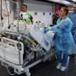 Medical staff at Haifa’s Rambam Medical Center transport a patient from the upper floors after Lebanon’s Hezbollah fired rockets on northern Israel. AFP