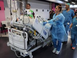 Medical staff at Haifa’s Rambam Medical Center transport a patient from the upper floors after Lebanon’s Hezbollah fired rockets on northern Israel. AFP