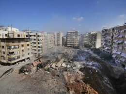 People gather at the site of the assassination of Hezbollah’s leader Hassan Nasrallah in Beirut’s southern suburbs. AP