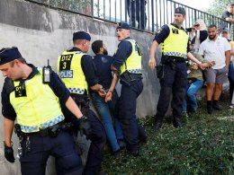 Swedish police intervene during opposition to the burning of the Quran in Stockholm. Reuters