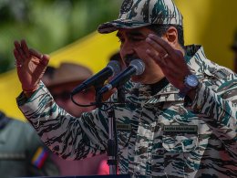 Venezuelan Dictator Nicolas Maduro speaks during a rally on the 22nd anniversary of the coup against Hugo Chavez. shutterstock.com