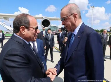 Turkish President Recep Erdogan (R) greets Egyptian President Abdel Fattah El-Sissi (L). Turkish Presidency