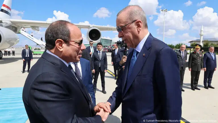 Turkish President Recep Erdogan (R) greets Egyptian President Abdel Fattah El-Sissi (L). Turkish Presidency