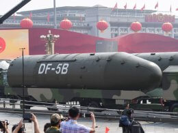 Vehicles carrying DF-5B intercontinental ballistic missiles participate in a military parade at Tiananmen Square in Beijing. AFP