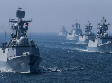 A fleet of Chinese ships sail out at sea after a joint naval drill with Russia. Reuters