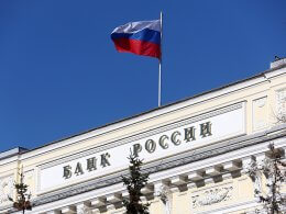 A Russian flag flies atop the Russian central bank. VCG