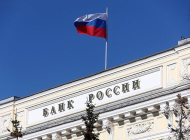 A Russian flag flies atop the Russian central bank. VCG