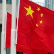 Police officers raise Chinese and Hong Kong flags during a ceremony to mark the Chinese National Day in Hong Kong. Reuters