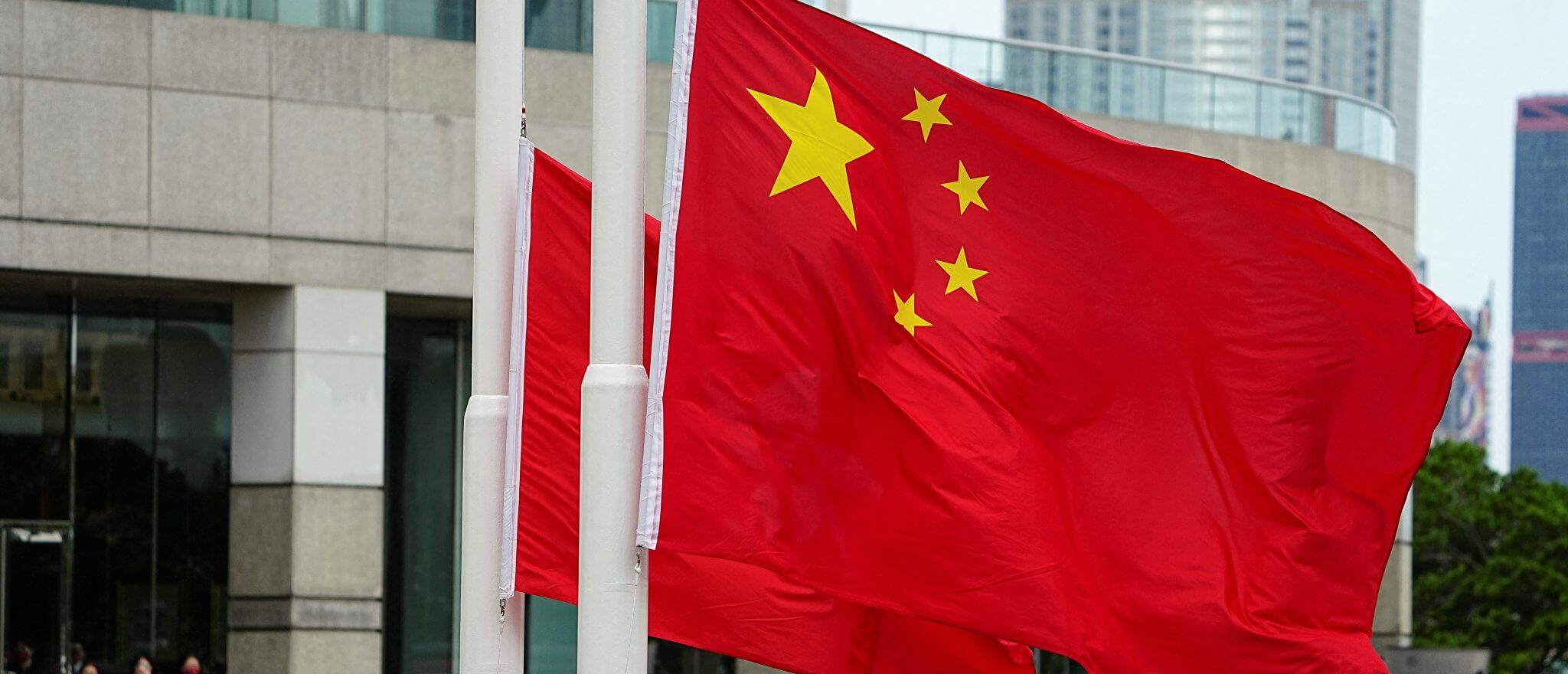 Police officers raise Chinese and Hong Kong flags during a ceremony to mark the Chinese National Day in Hong Kong. Reuters