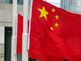 Police officers raise Chinese and Hong Kong flags during a ceremony to mark the Chinese National Day in Hong Kong. Reuters