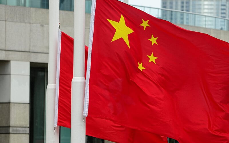 Police officers raise Chinese and Hong Kong flags during a ceremony to mark the Chinese National Day in Hong Kong. Reuters