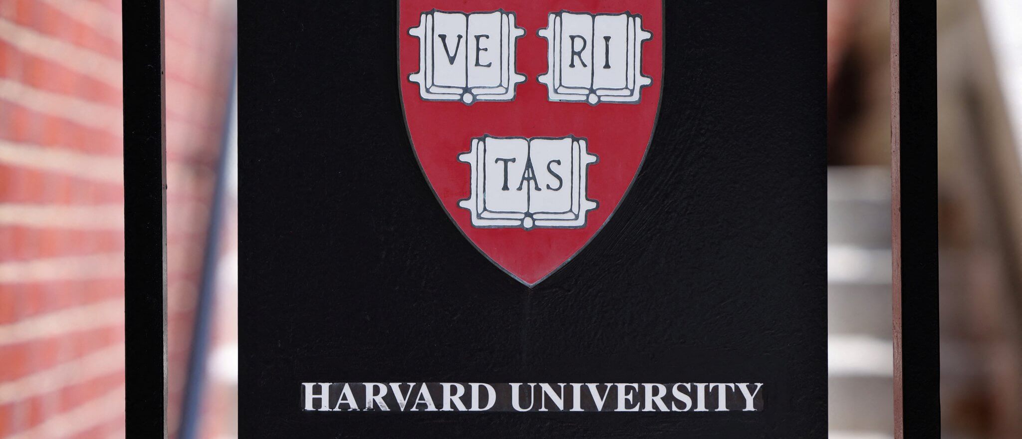 A sign hangs on a gate of a building at Harvard University in Cambridge, Massachusetts, U.S., July 6, 2023. Reuters