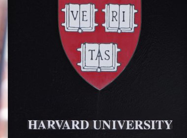 A sign hangs on a gate of a building at Harvard University in Cambridge, Massachusetts, U.S., July 6, 2023. Reuters