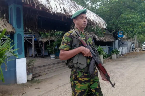 A police officer in Arugam Bay, Sri Lanka. AP