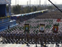 Regime soldiers march in a military parade. AFP