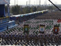 Regime soldiers march in a military parade. AFP