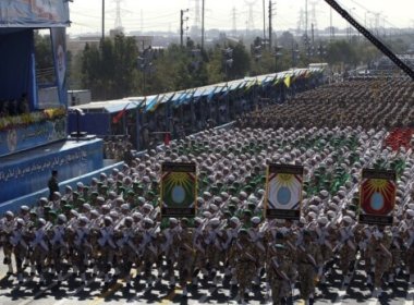 Regime soldiers march in a military parade. AFP