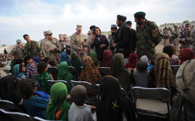 Representative Nancy Pelosi (D-CA) talks to a group of female students at at school near Cop Turbett in Marjah, Helmand Province, Afghanistan, on Sunday, March 20, 2011. Department of State