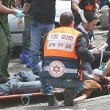 Israeli medics help people wounded during a 2006 suicide attack in Tel Aviv. Reuters