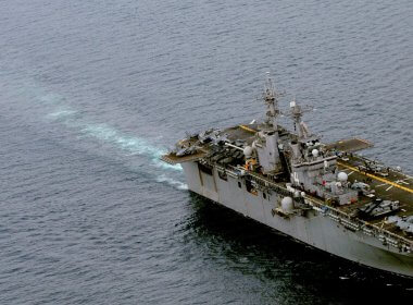 A landing craft approaches the amphibious assault ship USS Boxer for docking. U.S. Navy photo